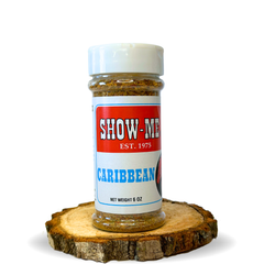 Show-Me® Caribbean Seasoning 6 oz shaker on a wood round