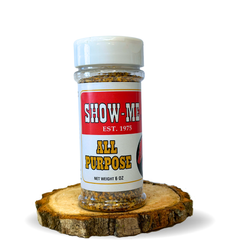 Show-Me® All Purpose Seasoning 6 oz shaker on a wood round