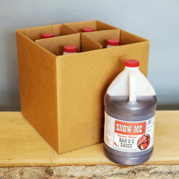 Case of 4 Show-Me® 'Some Heat' Bar-B-Q Sauce gallon jugs in a cardboard box